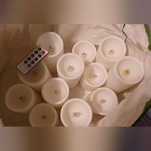 SET OF 12 BATTERY OPERATED CANDLES Various heights.